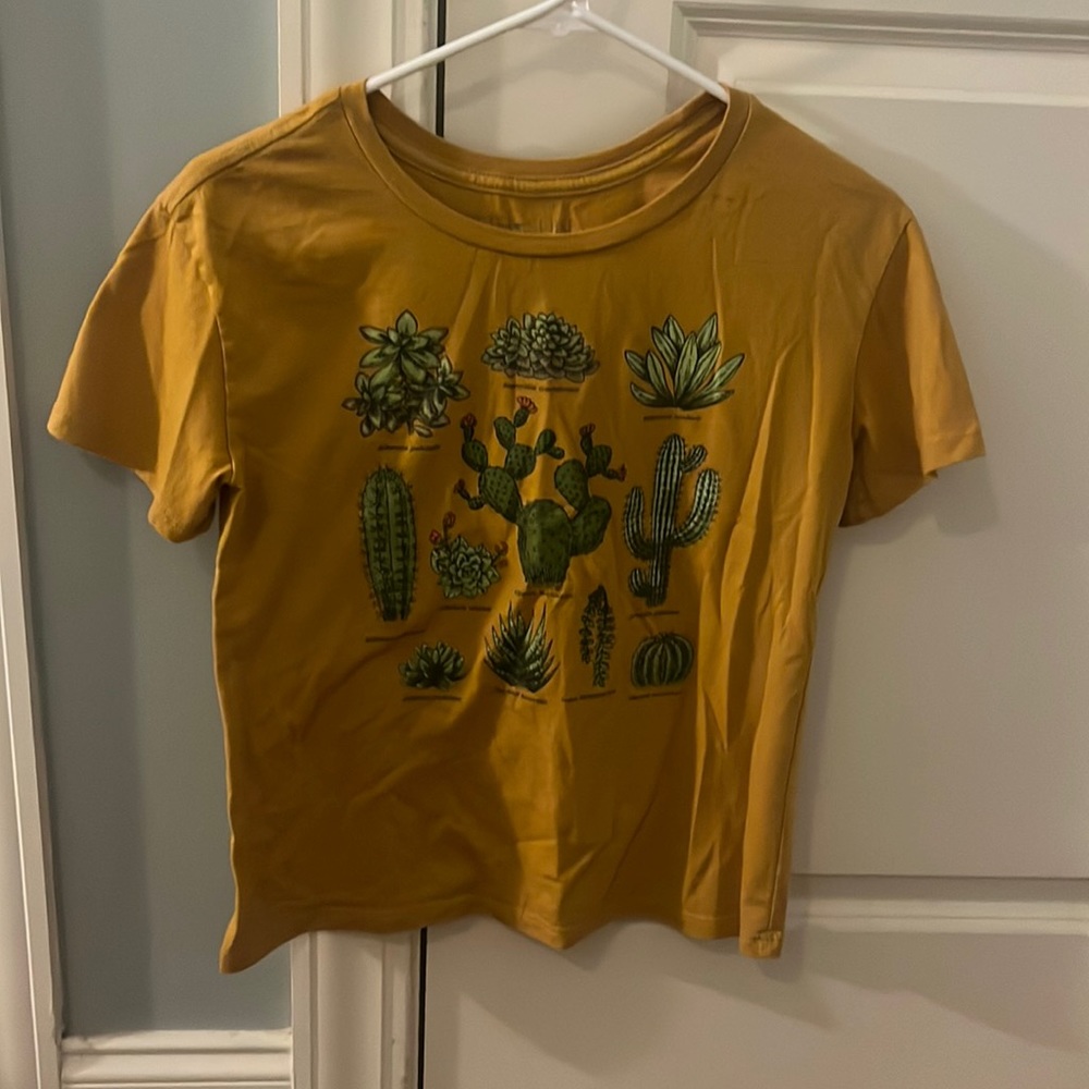 bought from target, womans small, golden yellow shirt with different plants